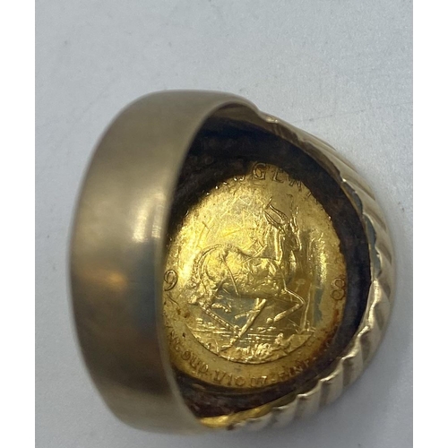 96 - A 9ct gentleman's gold signet ring set with 1/10th Krugerrand. 8.1g. Size L.