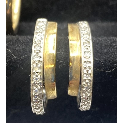 97 - A pair of 9ct gold hoop earrings together with a pair of 9ct gold diamond set earrings. 5.40g