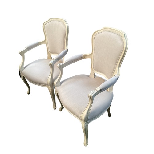 520 - A pair of French style upholstered open arm chairs