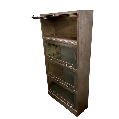 518 - Globe Wernicke style one piece metal cabinet with four sections.