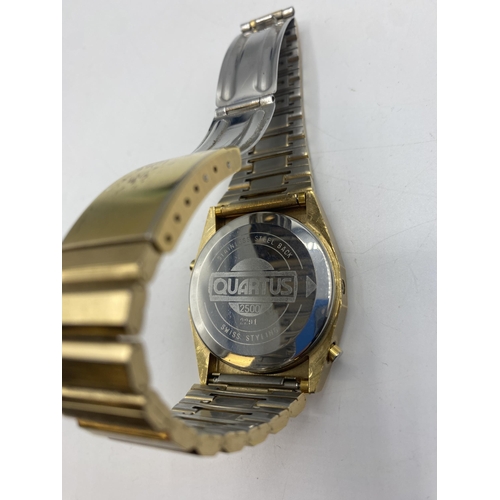 112 - A Quartus 2500 gilt metal digital watch. Red LED face with original bracelet strap. Numbered 2291.