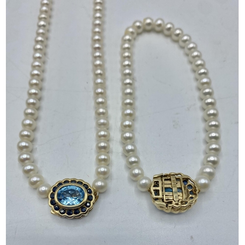 124 - A strand of uniform pearls with 9ct gold Topaz and single cut sapphire clasp with matching bracelet.... 