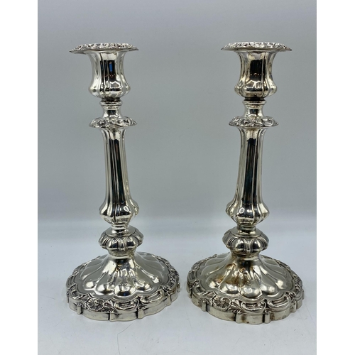 129 - A pair of  sterling silver candlesticks with weighted bases. 25cm (h) Sheffield 1839. With later unm... 