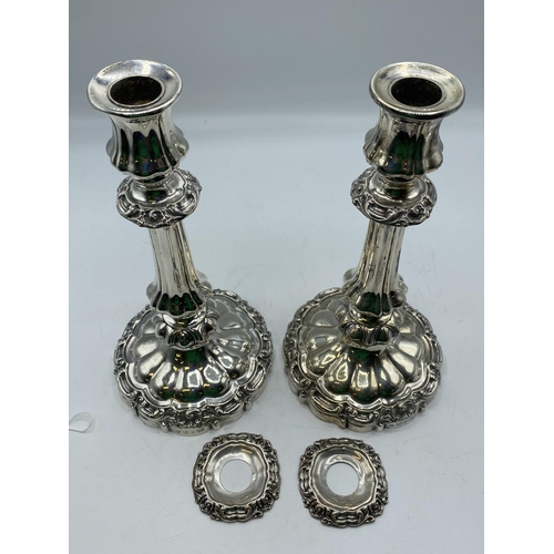 129 - A pair of  sterling silver candlesticks with weighted bases. 25cm (h) Sheffield 1839. With later unm... 