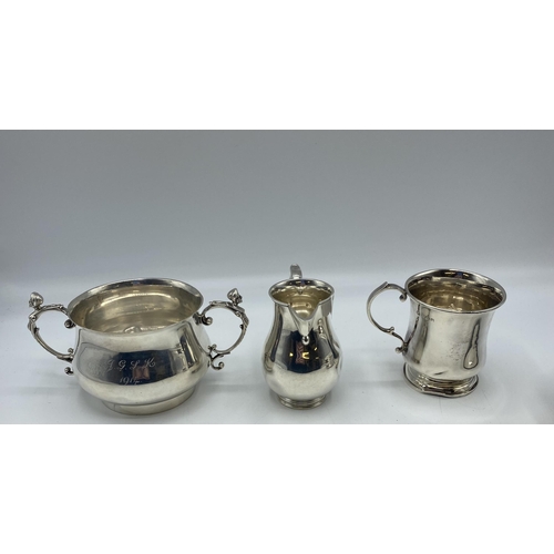 131 - A collection of sterling silver items to include a bottle coaster , cream jug, etc, Gross weight 706... 