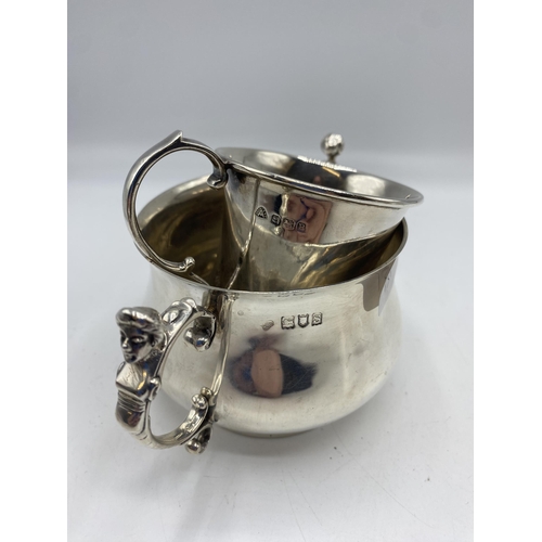 131 - A collection of sterling silver items to include a bottle coaster , cream jug, etc, Gross weight 706... 