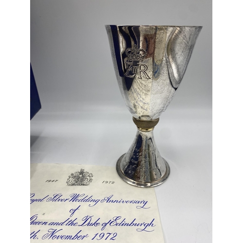 132 - A sterling silver and yellow metal goblet with gilt interior commemorating Elizabeth II silver weddi... 