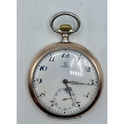 140 - Omega. An 800 silver and gilt yellow metal crown wind pocket watch . Cream face with Arabic markers ... 