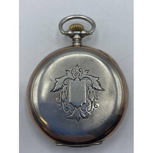 140 - Omega. An 800 silver and gilt yellow metal crown wind pocket watch . Cream face with Arabic markers ... 