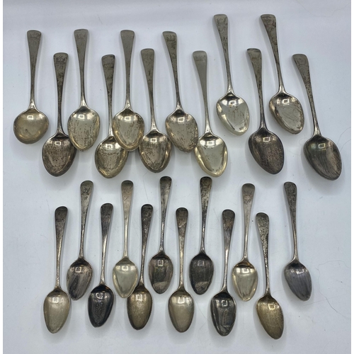 143 - A collection of sterling silver flatware. A set of 12 desert spoons and 12 tea spoons by Thomas Nort... 