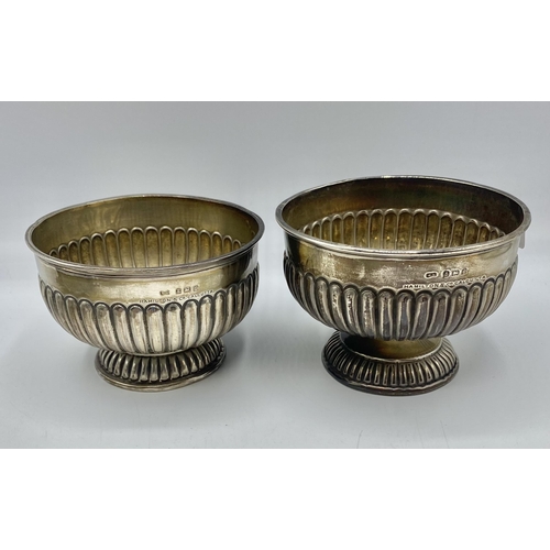 144 - A pair of sterling silver circular fluted bowls together with a Mappin and Webb bowl with cast feet ... 
