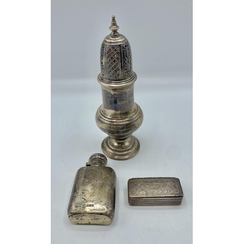146 - A collection of sterling silver items, sugar castor, small hip flask and an etched snuff by William ... 