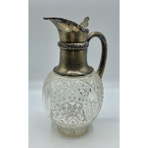 152 - A sterling silver topped cut glass claret jug. 22cm(h) by Walker and Hall, Sheffield, 1910