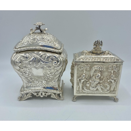 195 - A sterling silver tea caddy with repousse decoration by Carrington & Co London together with a a sim... 