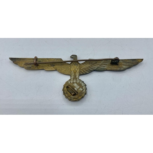 208 - A WWII Heer Breast eagle Officers summer tunic badge. Wermacht eagle clutching wreathed swastika. Un... 