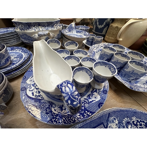 213 - A Spode dining service.  Blue and white Italian pattern. With lidded tureens , serving platters etc,