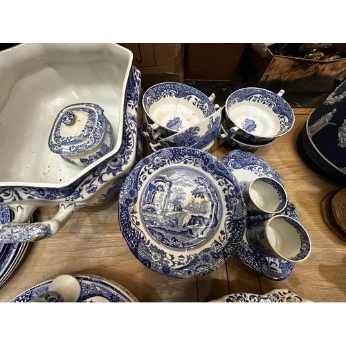 213 - A Spode dining service.  Blue and white Italian pattern. With lidded tureens , serving platters etc,