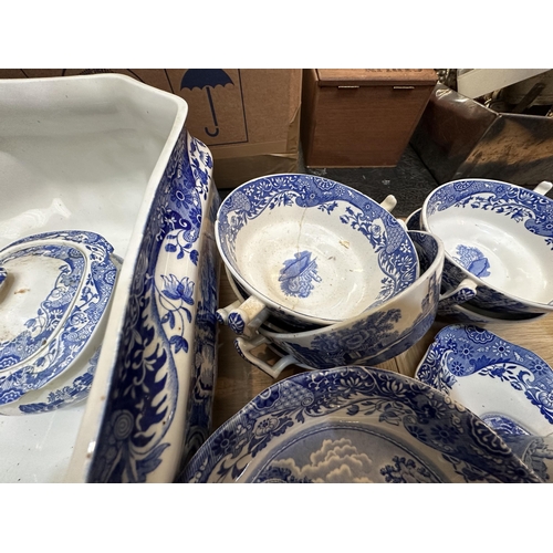 213 - A Spode dining service.  Blue and white Italian pattern. With lidded tureens , serving platters etc,