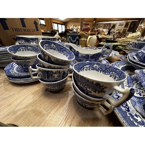 213 - A Spode dining service.  Blue and white Italian pattern. With lidded tureens , serving platters etc,