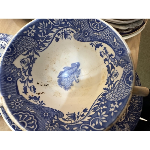 213 - A Spode dining service.  Blue and white Italian pattern. With lidded tureens , serving platters etc,