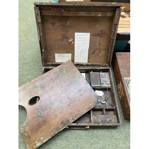 219 - A quantity of artist materials, including a wooden cased set with wooden easel and metal divisional ... 