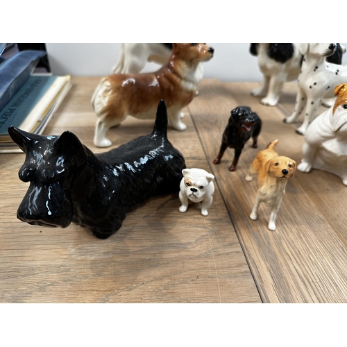 240 - A china dog collection to include: 4 x Beswick - Scottie, Golden Retriever, Rotweiller, Bull dog; 2 ... 