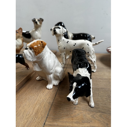 240 - A china dog collection to include: 4 x Beswick - Scottie, Golden Retriever, Rotweiller, Bull dog; 2 ... 