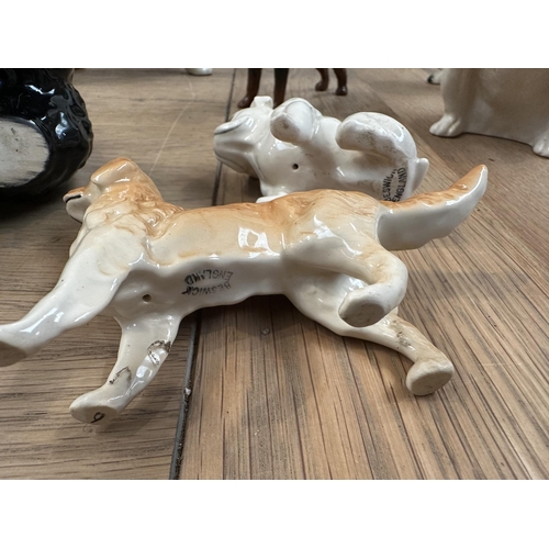 240 - A china dog collection to include: 4 x Beswick - Scottie, Golden Retriever, Rotweiller, Bull dog; 2 ... 