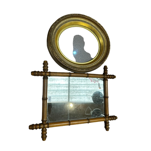 256 - A bamboo framed wall mirror 64c, H, and a glazed oval gilt frame 47cmH