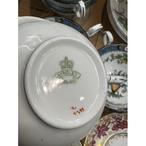 258 - A Wedgwood part dinner service, and An Aynsley tea set and a Thomas Goode & Co gilt set of six coffe... 