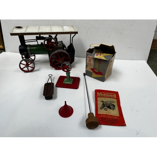 279 - A Mamod steam tractor with instructions and some accessories. 17cm x 29cm.