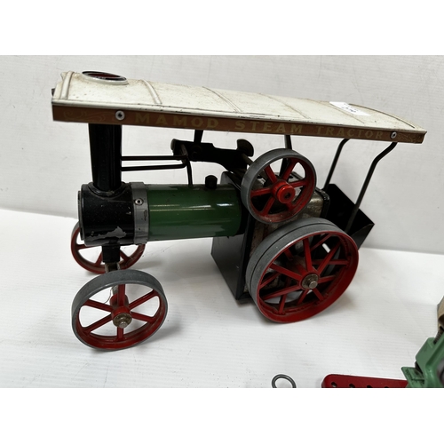 279 - A Mamod steam tractor with instructions and some accessories. 17cm x 29cm.