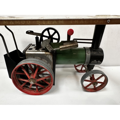 279 - A Mamod steam tractor with instructions and some accessories. 17cm x 29cm.