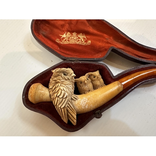 284 - Two Meerschaum pipes one in case together with three Royal Doulton figurines of Dickens characters.