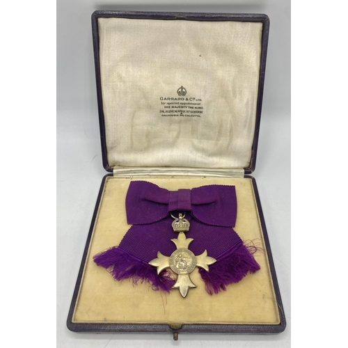 291 - A boxed OBE. Gilt Sterling silver by Garrard and Co.