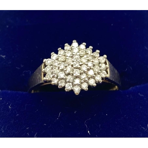 78 - A 9ct gold and white metal diamond cluster ring , numerously set with single brilliant cut diamonds,... 