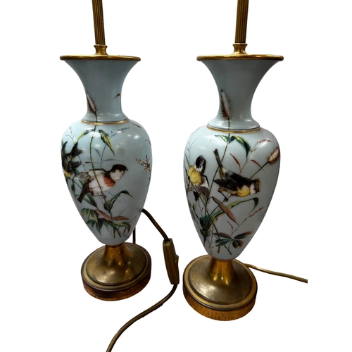 302 - Two pairs of good lamps,  late C19th and early C20th, one  pair milk glass with overlaid flora and f... 