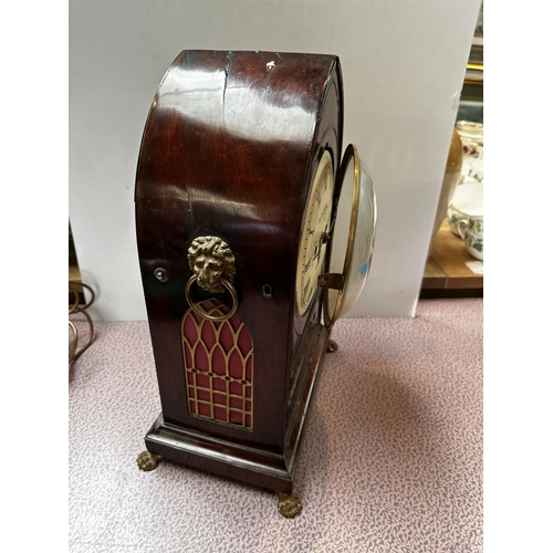 306 - A mahogany and brass cased mantle clock, the cream circular dial with black Roman Numerals marked W.... 