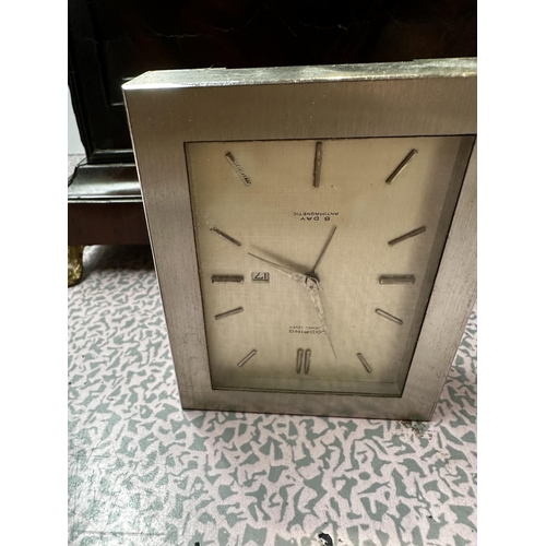 306 - A mahogany and brass cased mantle clock, the cream circular dial with black Roman Numerals marked W.... 