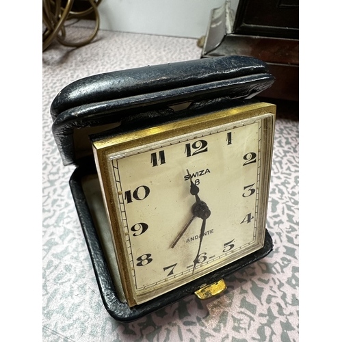 306 - A mahogany and brass cased mantle clock, the cream circular dial with black Roman Numerals marked W.... 