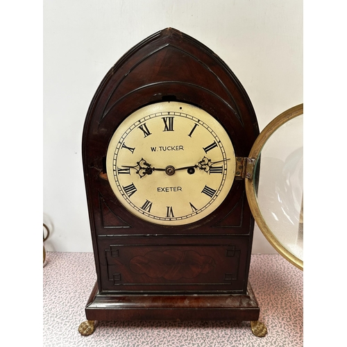 306 - A mahogany and brass cased mantle clock, the cream circular dial with black Roman Numerals marked W.... 