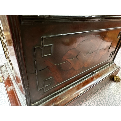 306 - A mahogany and brass cased mantle clock, the cream circular dial with black Roman Numerals marked W.... 