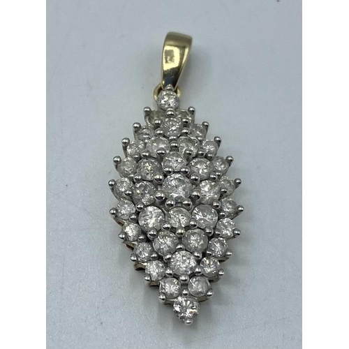178 - A 9ct gold diamond set navette shaped pendant. 4.21g. Approx 30mm including bale.