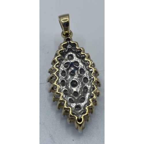 178 - A 9ct gold diamond set navette shaped pendant. 4.21g. Approx 30mm including bale.
