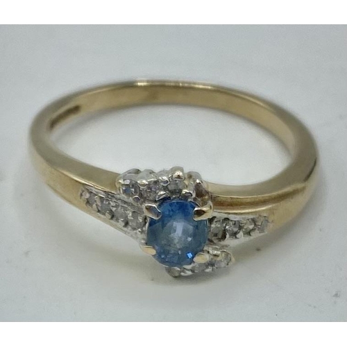40 - A 9ct gold blue topaz and diamond ring. Size P. 2.61g