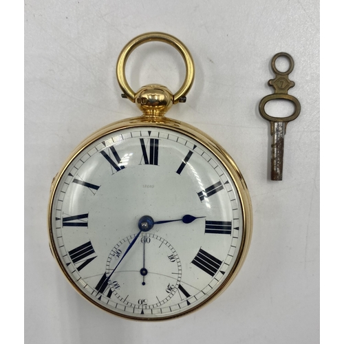 9 - An 18ct gold cased open face key wind pocket watch. White dial with Roman numeral markers, Subsidiar... 