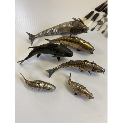 150 - A collection of silver plated and white metal items, the fishes were purchased from Hymie Danker in ... 