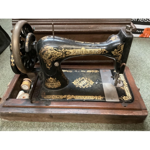 236 - A vintage Singer sewing machine, and two brass letter door boxes