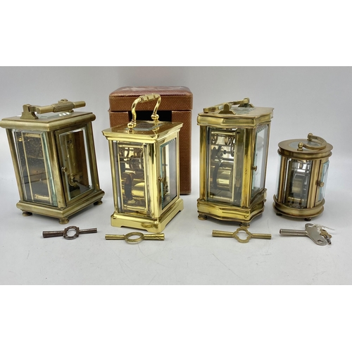 259 - Four gilt brass carriage clocks one with original fitted travel case.