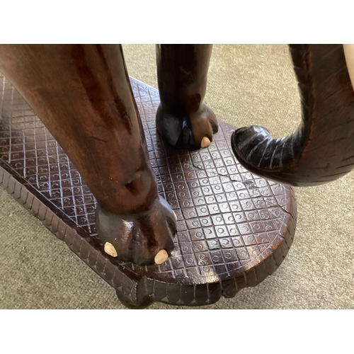 298 - Anglo Indian hardwood occasional table, with carved elephant base, 72cm High